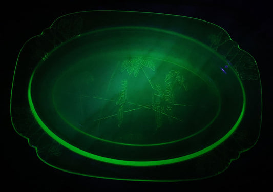 Lot 089 - Vintage Green Uranium Vaseline Glass Oval Dish By Federal Glass, Tropical Parrot And Palm Tree Motifs, Raised Underside Designs, Circa 1931, 11-1/2" x 8-1/4"