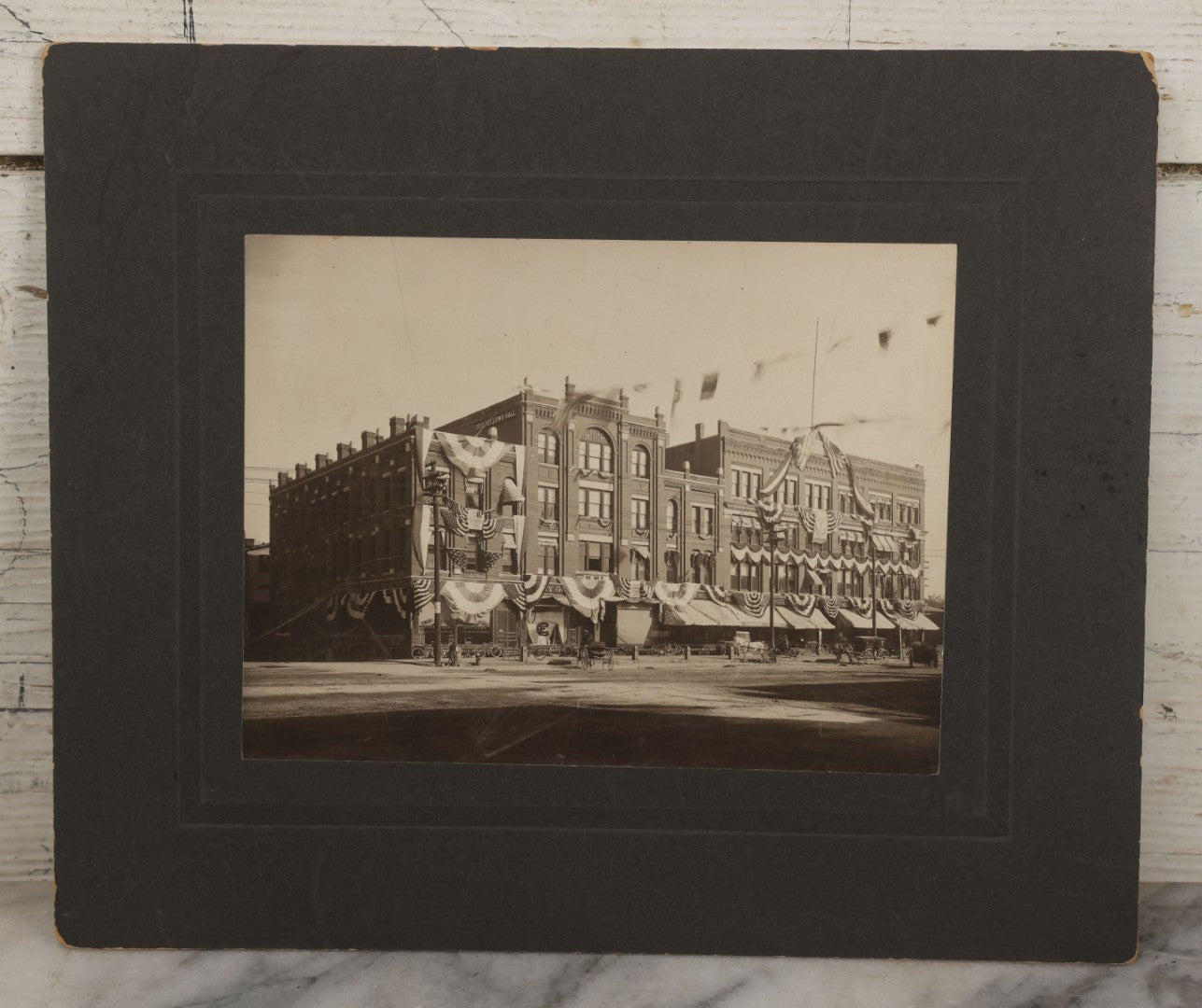 Lot 115 - Antique Boarded Photograph Of The E.F. Lane Building And Gurney's Block, Main Street, Keene, New Hampshire, Decorated With Flags And Patriotic Bunting