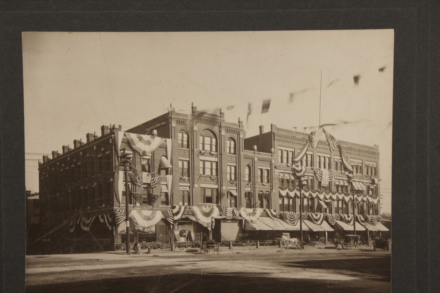 Lot 115 - Antique Boarded Photograph Of The E.F. Lane Building And Gurney's Block, Main Street, Keene, New Hampshire, Decorated With Flags And Patriotic Bunting