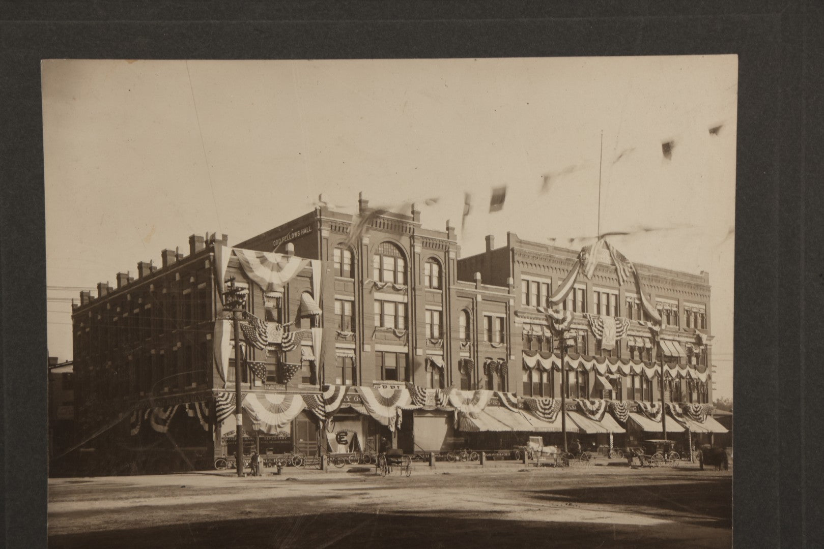 Lot 115 - Antique Boarded Photograph Of The E.F. Lane Building And Gurney's Block, Main Street, Keene, New Hampshire, Decorated With Flags And Patriotic Bunting
