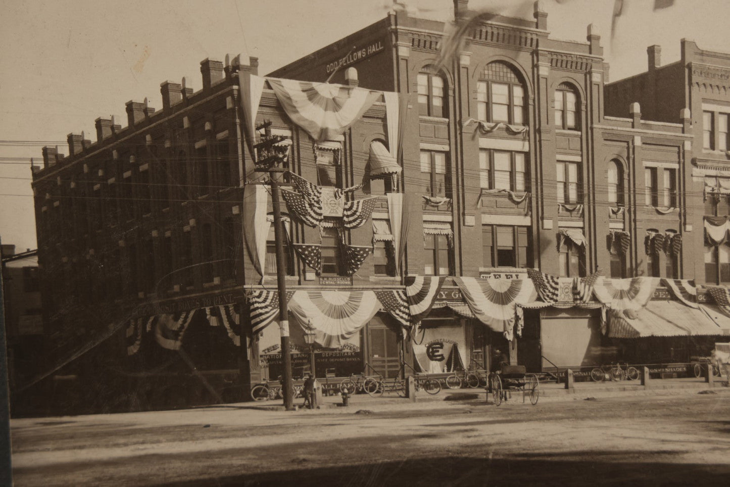 Lot 115 - Antique Boarded Photograph Of The E.F. Lane Building And Gurney's Block, Main Street, Keene, New Hampshire, Decorated With Flags And Patriotic Bunting