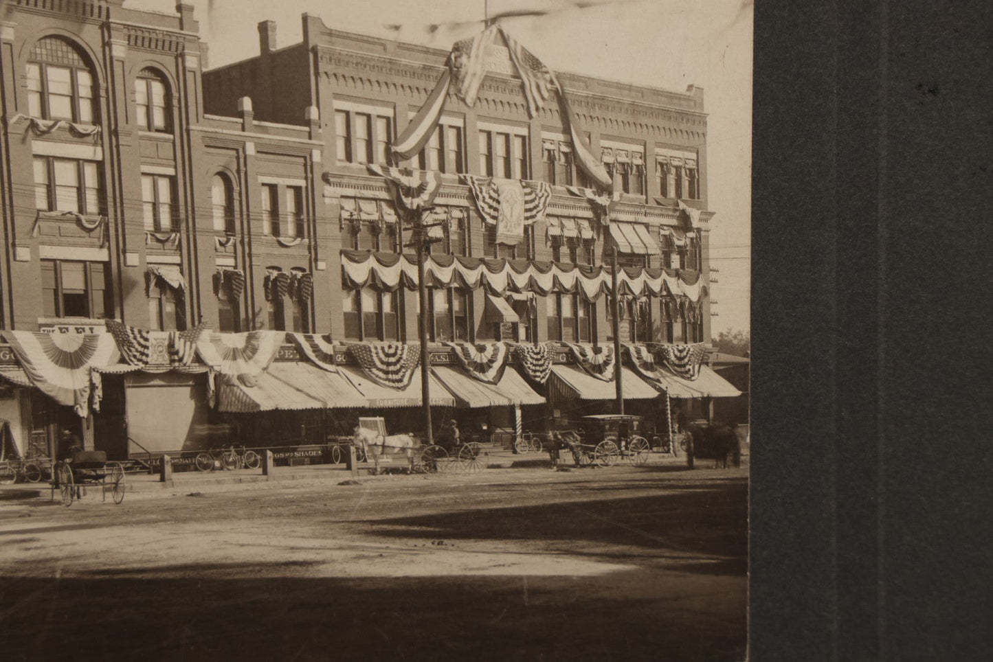 Lot 115 - Antique Boarded Photograph Of The E.F. Lane Building And Gurney's Block, Main Street, Keene, New Hampshire, Decorated With Flags And Patriotic Bunting