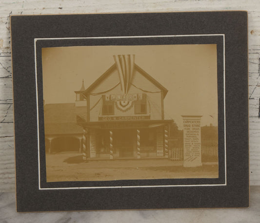 Lot 116 - Antique Boarded Photograph Of George W. Carpenter's Drug Store Apothecary, Likely Keene, New Hampshire, Decorated With Flags And Patriotic Bunting