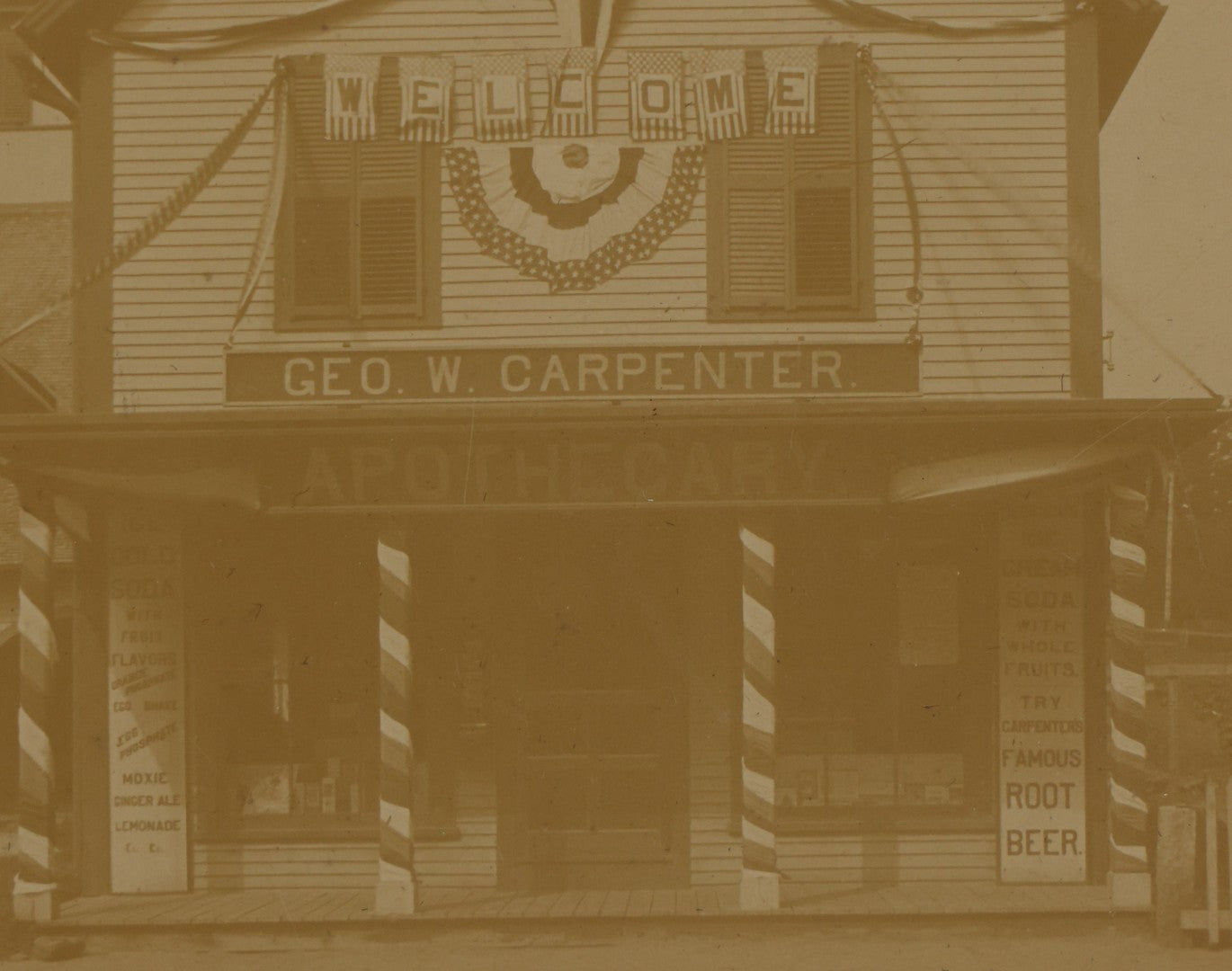 Lot 116 - Antique Boarded Photograph Of George W. Carpenter's Drug Store Apothecary, Likely Keene, New Hampshire, Decorated With Flags And Patriotic Bunting