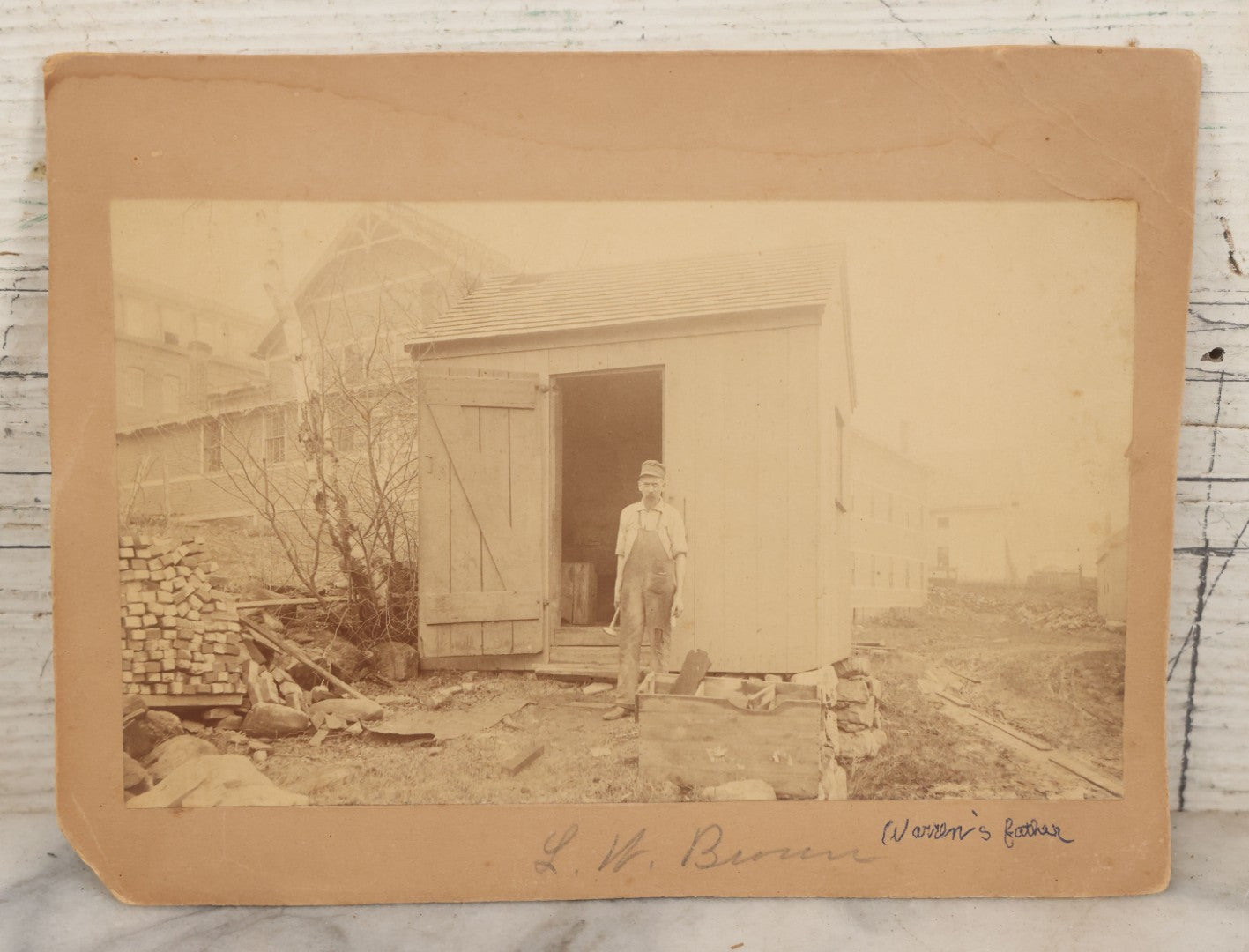 Lot 123 - Antique Boarded Occupational Photograph Of Bricklayer Beside Shed, Photographed By F.J. Taylor & Co., Cambridgeport, Mass