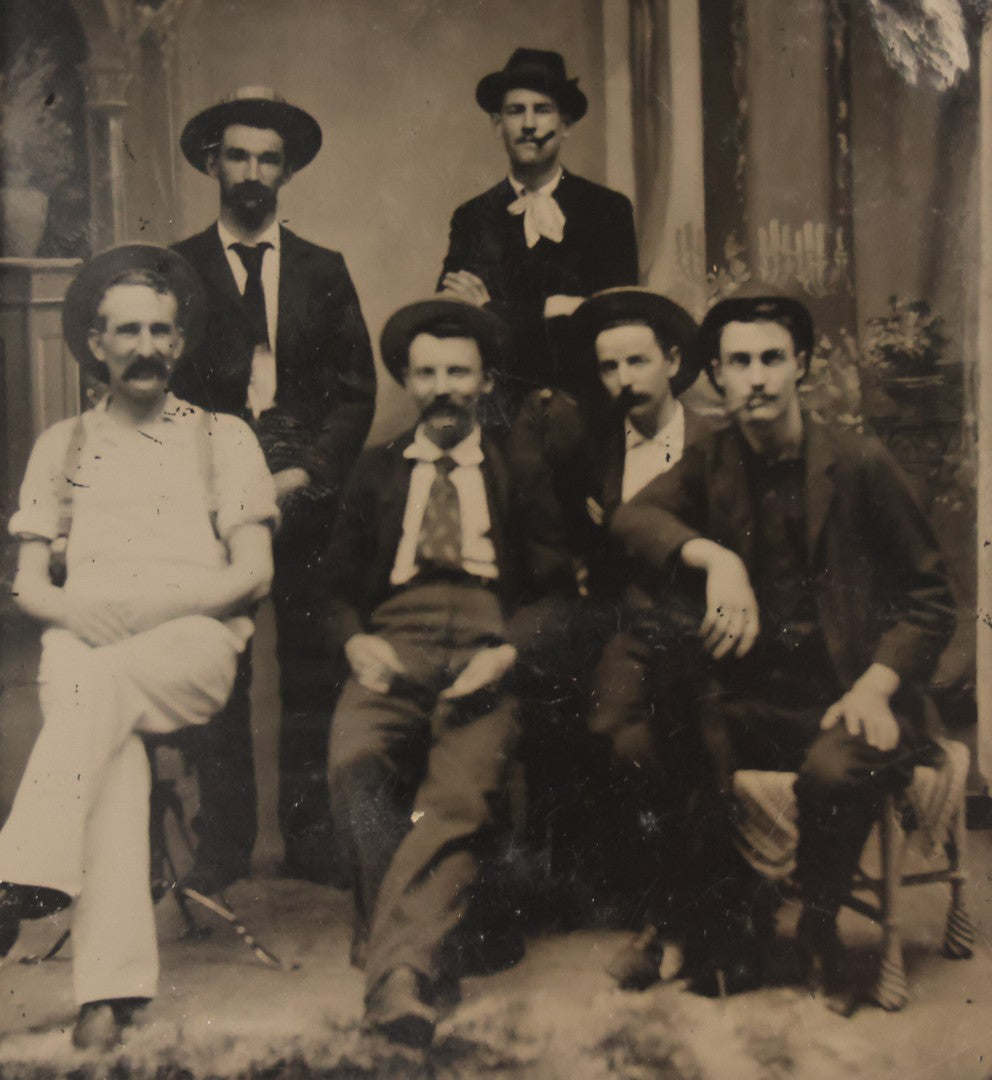 Lot 130 - Antique Tintype Photograph Of Six Men In Hats, Seated And Standing, Two Smoking Cigars In Studio Setting