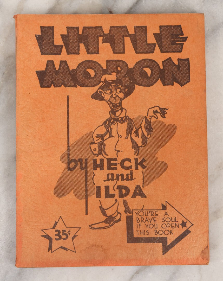 Lot 159 - "Little Moron" Vintage Comic Illustrated Joke Book Vintage Humor Book By Abbot “Heck” Hoecker And Clydene “Ilda” Oliver, Copyright 1943
