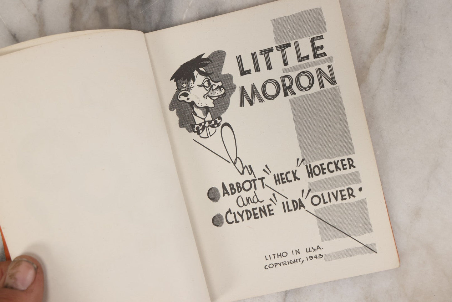 Lot 159 - "Little Moron" Vintage Comic Illustrated Joke Book Vintage Humor Book By Abbot “Heck” Hoecker And Clydene “Ilda” Oliver, Copyright 1943