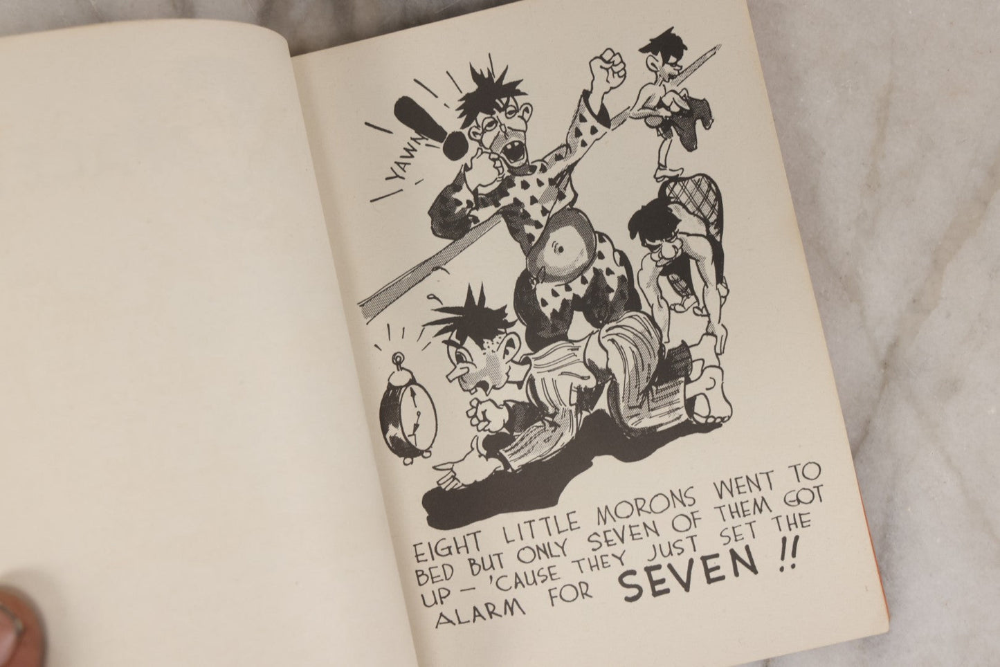 Lot 159 - "Little Moron" Vintage Comic Illustrated Joke Book Vintage Humor Book By Abbot “Heck” Hoecker And Clydene “Ilda” Oliver, Copyright 1943