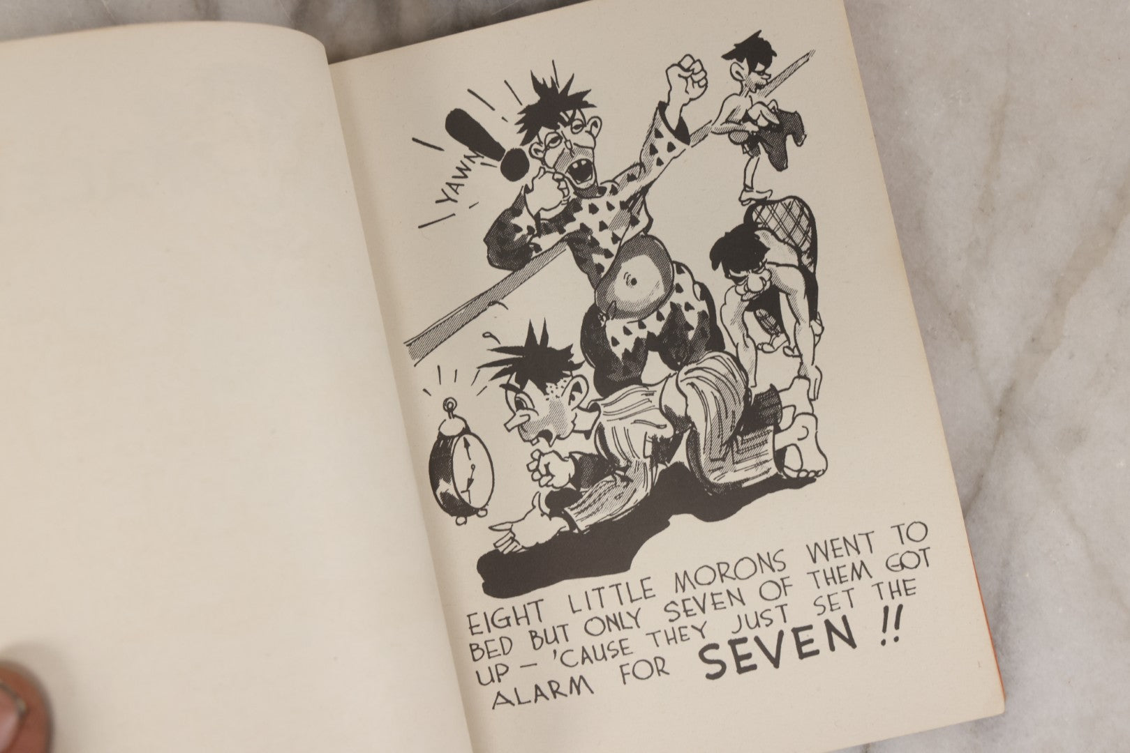 Lot 159 - "Little Moron" Vintage Comic Illustrated Joke Book Vintage Humor Book By Abbot “Heck” Hoecker And Clydene “Ilda” Oliver, Copyright 1943