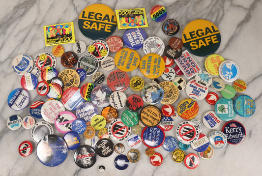 Lot 199 - Grouping Of 100+ Vintage And Modern Political Pinback Buttons, Late 20th–Early 21st Century, Including Bush-Era, Anti–Iraq War, Abortion Rights, Nuclear Issues, And Presidential Campaigns