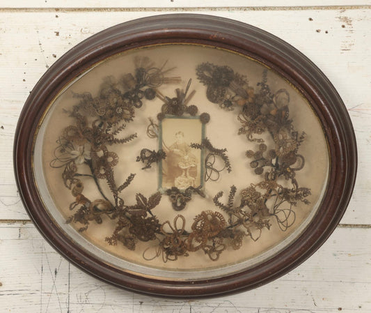 Lot 001 - Antique Victorian Mourning Memorial Human Hair Work Wreath In Deep Oval Shadowbox With Carte De Visite CDV Photograph Of Young Child In Blue Velvet Surround, 18-1/8" x 15-1/4"