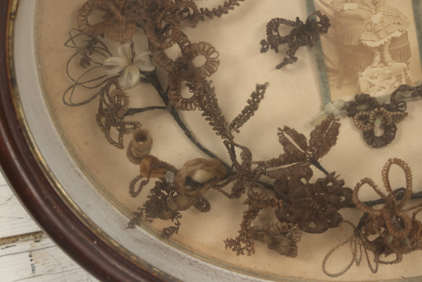 Lot 001 - Antique Victorian Mourning Memorial Human Hair Work Wreath In Deep Oval Shadowbox With Carte De Visite CDV Photograph Of Young Child In Blue Velvet Surround, 18-1/8" x 15-1/4"