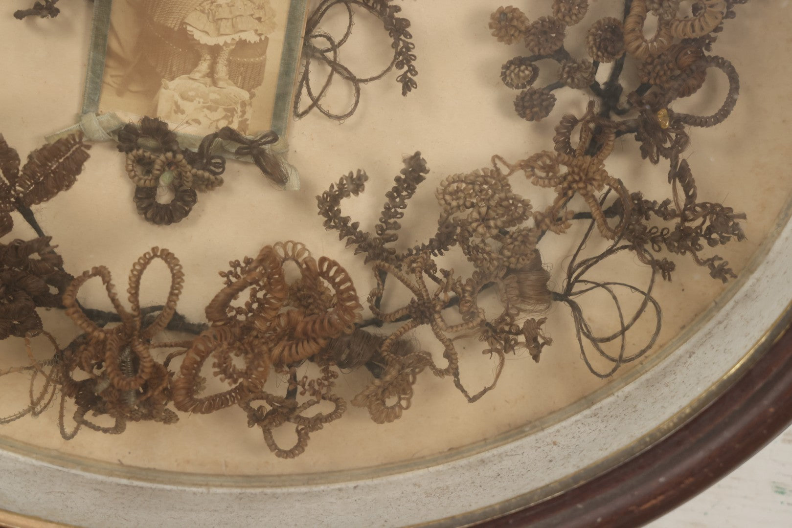 Lot 001 - Antique Victorian Mourning Memorial Human Hair Work Wreath In Deep Oval Shadowbox With Carte De Visite CDV Photograph Of Young Child In Blue Velvet Surround, 18-1/8" x 15-1/4"