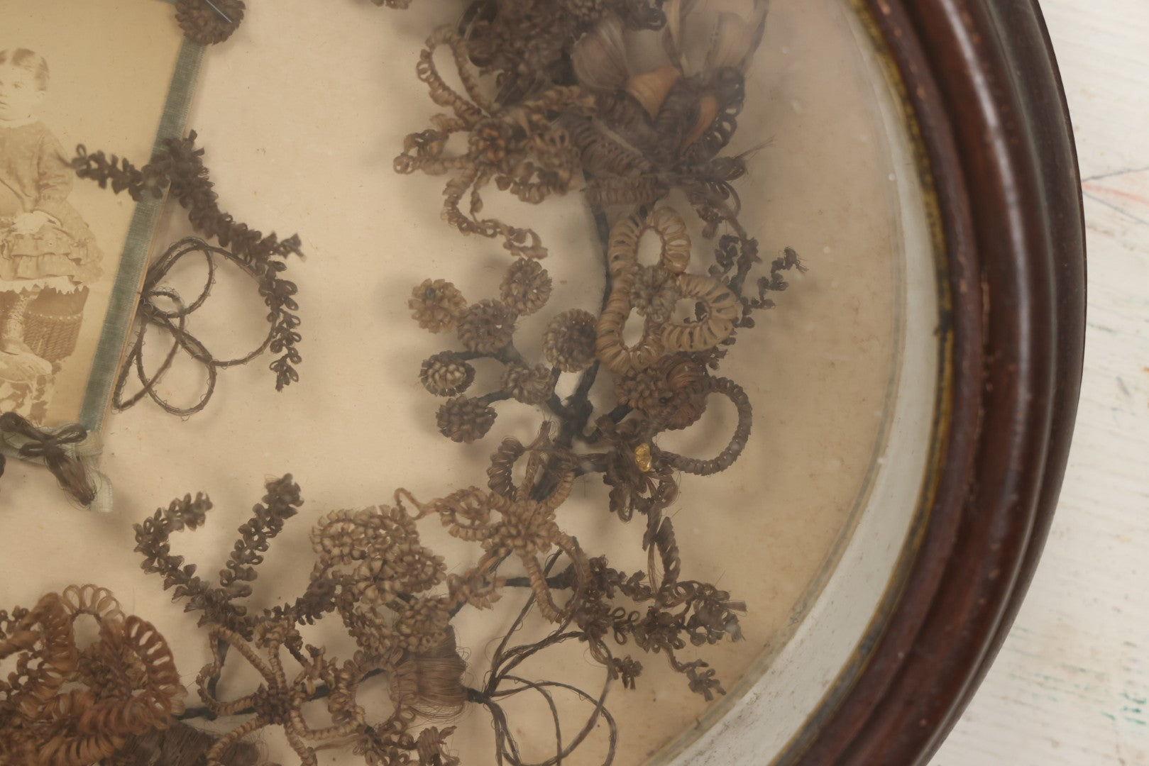 Lot 001 - Antique Victorian Mourning Memorial Human Hair Work Wreath In Deep Oval Shadowbox With Carte De Visite CDV Photograph Of Young Child In Blue Velvet Surround, 18-1/8" x 15-1/4"