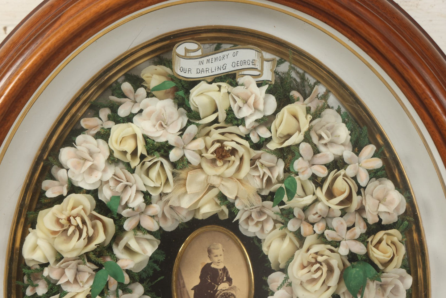 Lot 002 - Antique Victorian Mourning Memorial Preserved Flower Wreath "In Memory Of Our Darling George" In Original Deep Oval Shadowbox With Carte De Visite CDV Photograph And Hardy & Yarnall, Philadelphia Label, 17" x 20"
