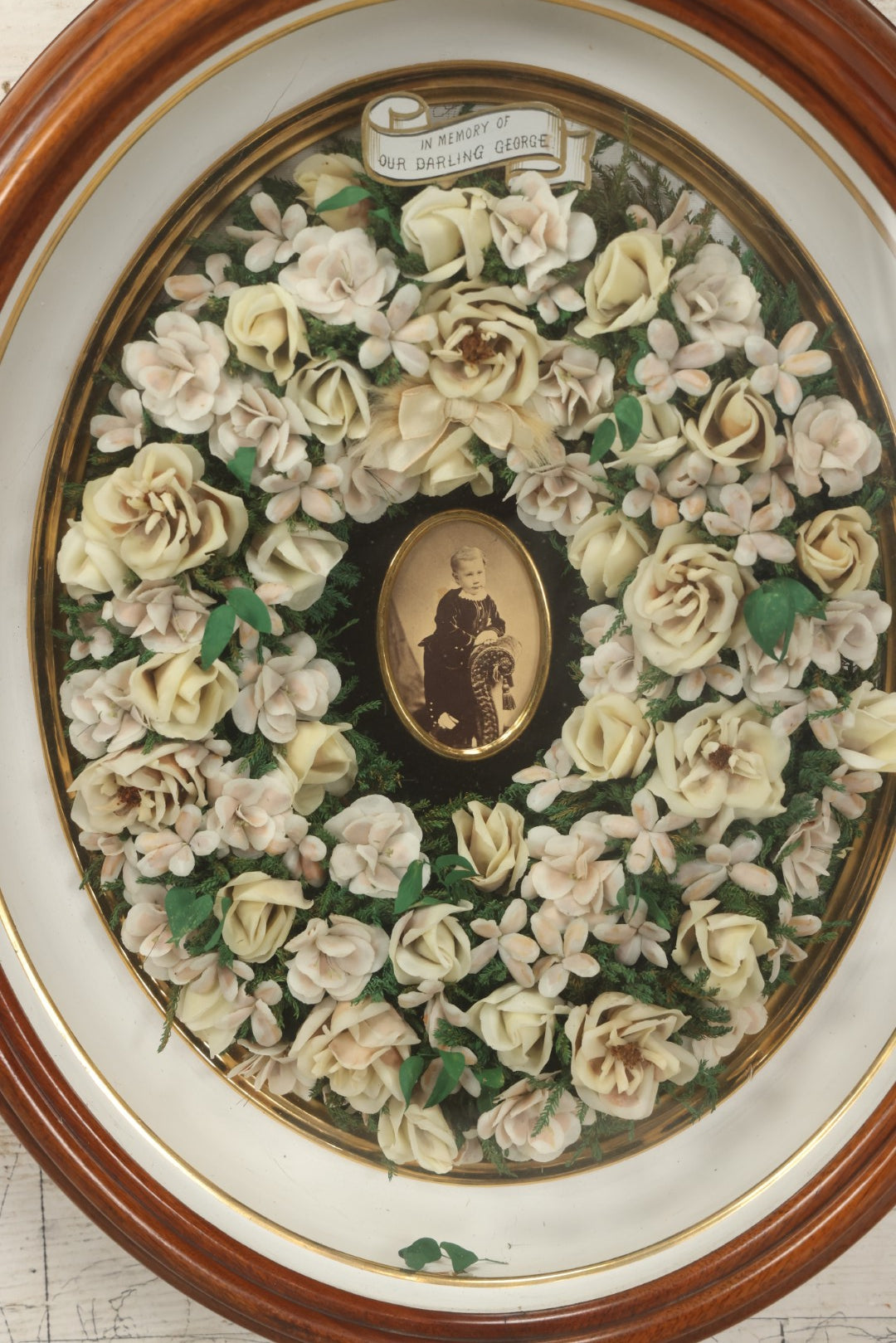 Lot 002 - Antique Victorian Mourning Memorial Preserved Flower Wreath "In Memory Of Our Darling George" In Original Deep Oval Shadowbox With Carte De Visite CDV Photograph And Hardy & Yarnall, Philadelphia Label, 17" x 20"