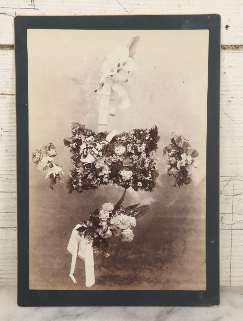 Lot 006 - Antique Boarded Mourning Photograph Depicting “Rest” Floral Pillow And Funeral Arrangements, 6-7/8" x 9-5/8"