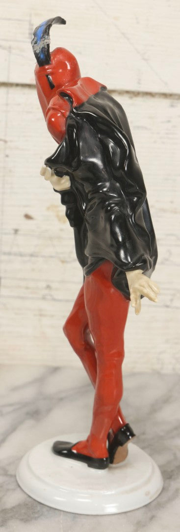 Lot 012 - Vintage Porcelain Mephisto (Mephistopheles) Figurine, By Karl Tutter For Hutschenreuther, Germany, Kunstabteilung, U.S. Zone Mark, Note Feather-On-Hat And Hood Repaired With Visible Glue, Circa 1955, 11-1/2" H