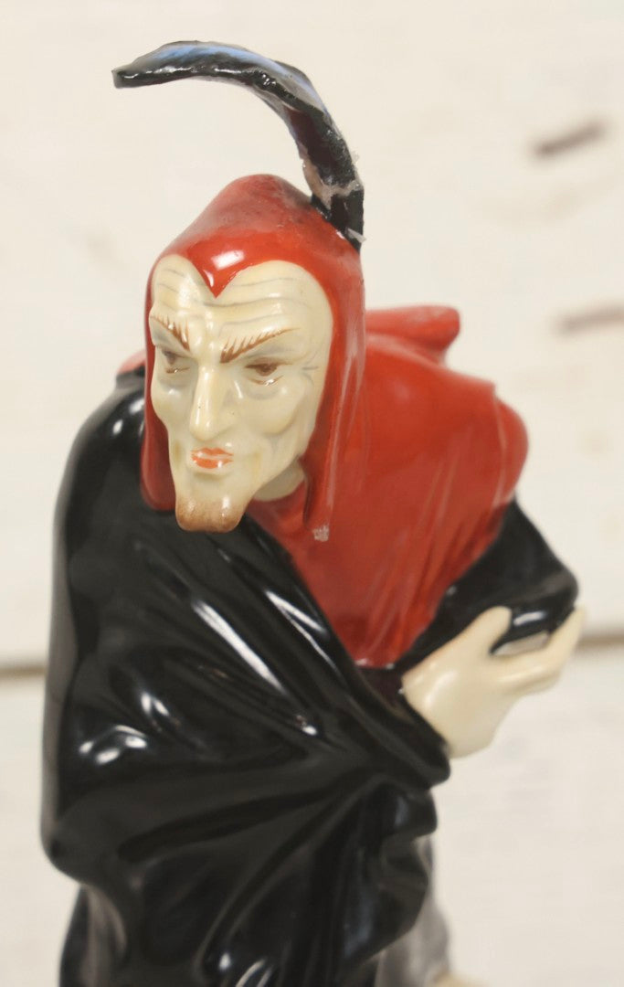 Lot 012 - Vintage Porcelain Mephisto (Mephistopheles) Figurine, By Karl Tutter For Hutschenreuther, Germany, Kunstabteilung, U.S. Zone Mark, Note Feather-On-Hat And Hood Repaired With Visible Glue, Circa 1955, 11-1/2" H