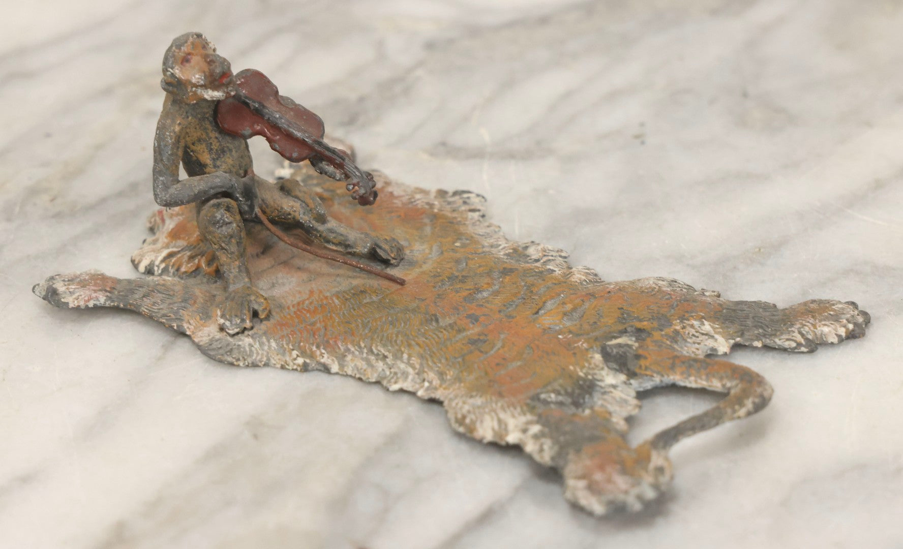 Lot 017 - Antique Cold-Painted Metal Paperweight Figurine Of Violin-Playing Monkey On Taxidermy Tiger Rug, Likely Austrian Or German