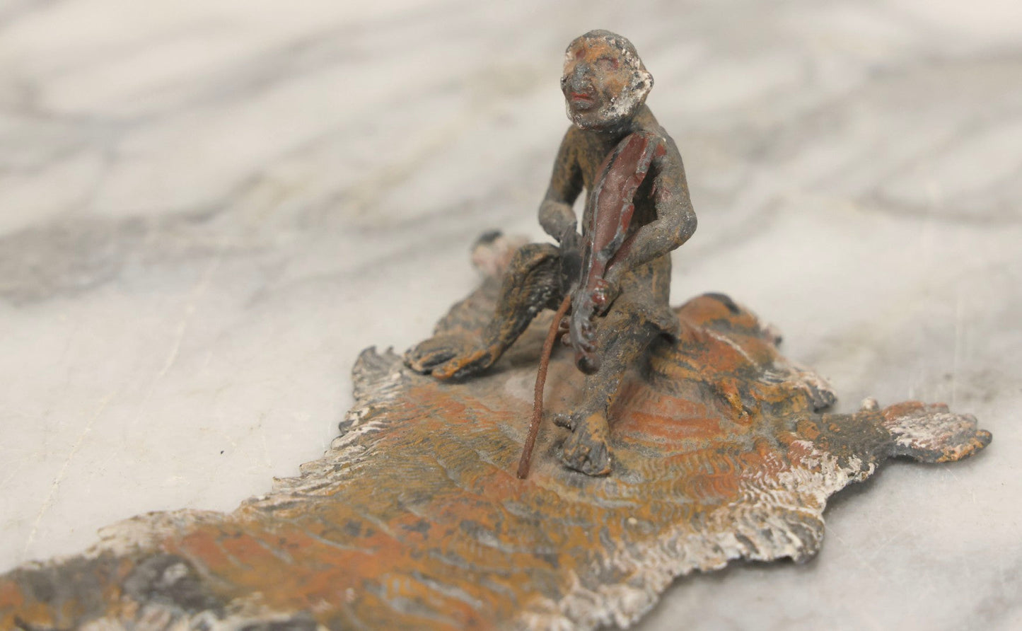 Lot 017 - Antique Cold-Painted Metal Paperweight Figurine Of Violin-Playing Monkey On Taxidermy Tiger Rug, Likely Austrian Or German