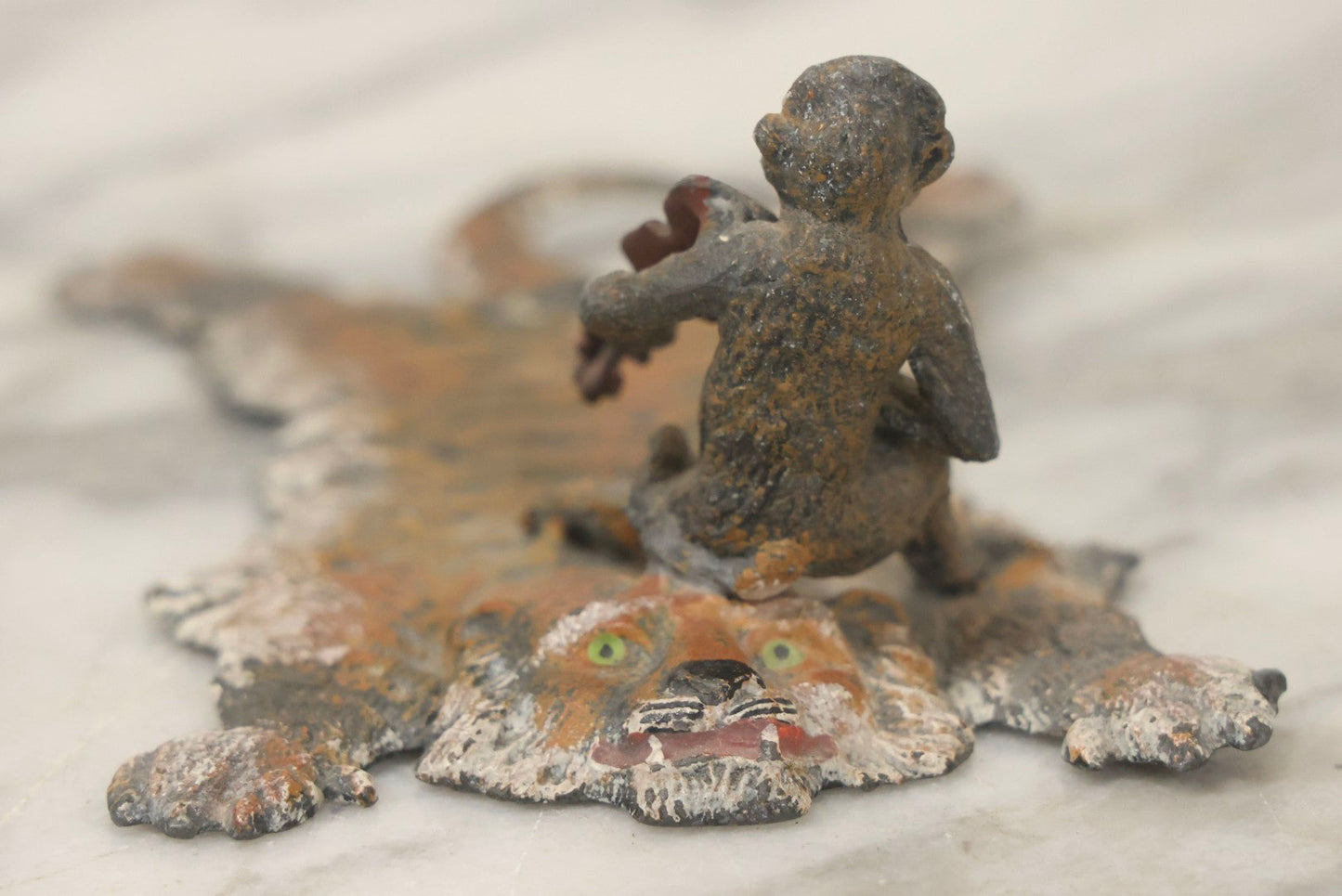 Lot 017 - Antique Cold-Painted Metal Paperweight Figurine Of Violin-Playing Monkey On Taxidermy Tiger Rug, Likely Austrian Or German
