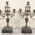 Lot 018 - Pair Of Antique Brass Three-Arm Candelabras With Floral Rosettes, Chains, And Ornate Ornamentation On Black Slate Bases, Circa 1850, 13-1/2" H Each