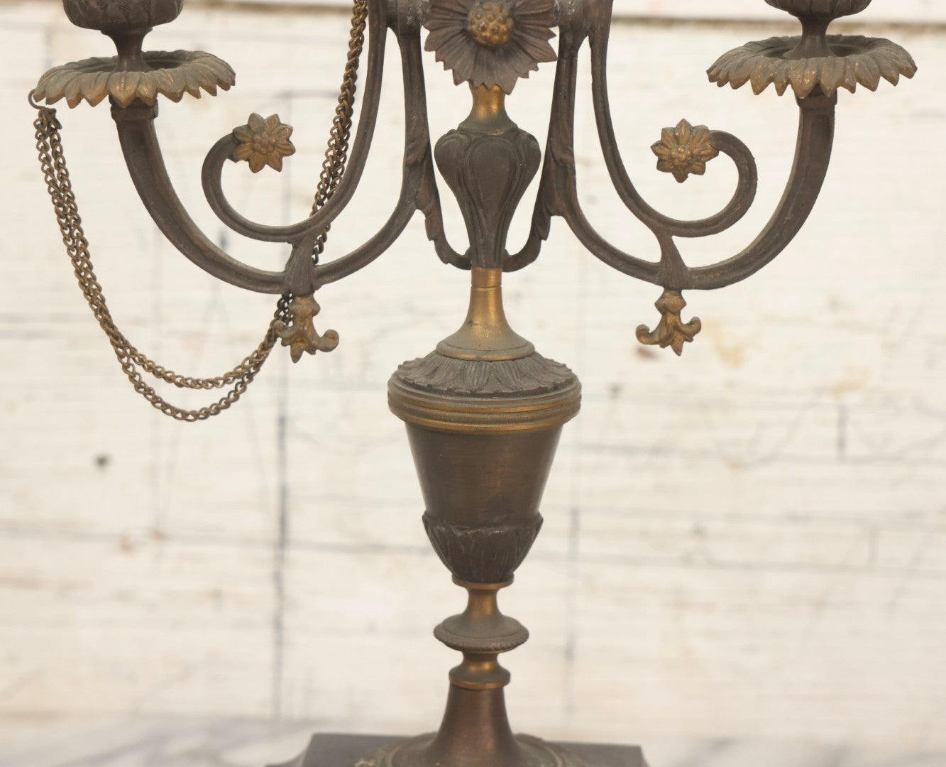 Lot 018 - Pair Of Antique Brass Three-Arm Candelabras With Floral Rosettes, Chains, And Ornate Ornamentation On Black Slate Bases, Circa 1850, 13-1/2" H Each