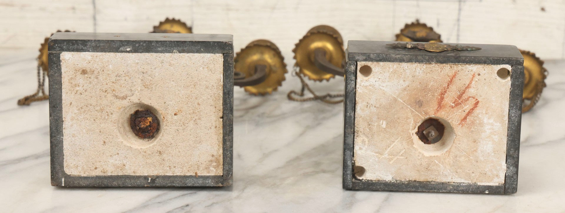 Lot 018 - Pair Of Antique Brass Three-Arm Candelabras With Floral Rosettes, Chains, And Ornate Ornamentation On Black Slate Bases, Circa 1850, 13-1/2" H Each