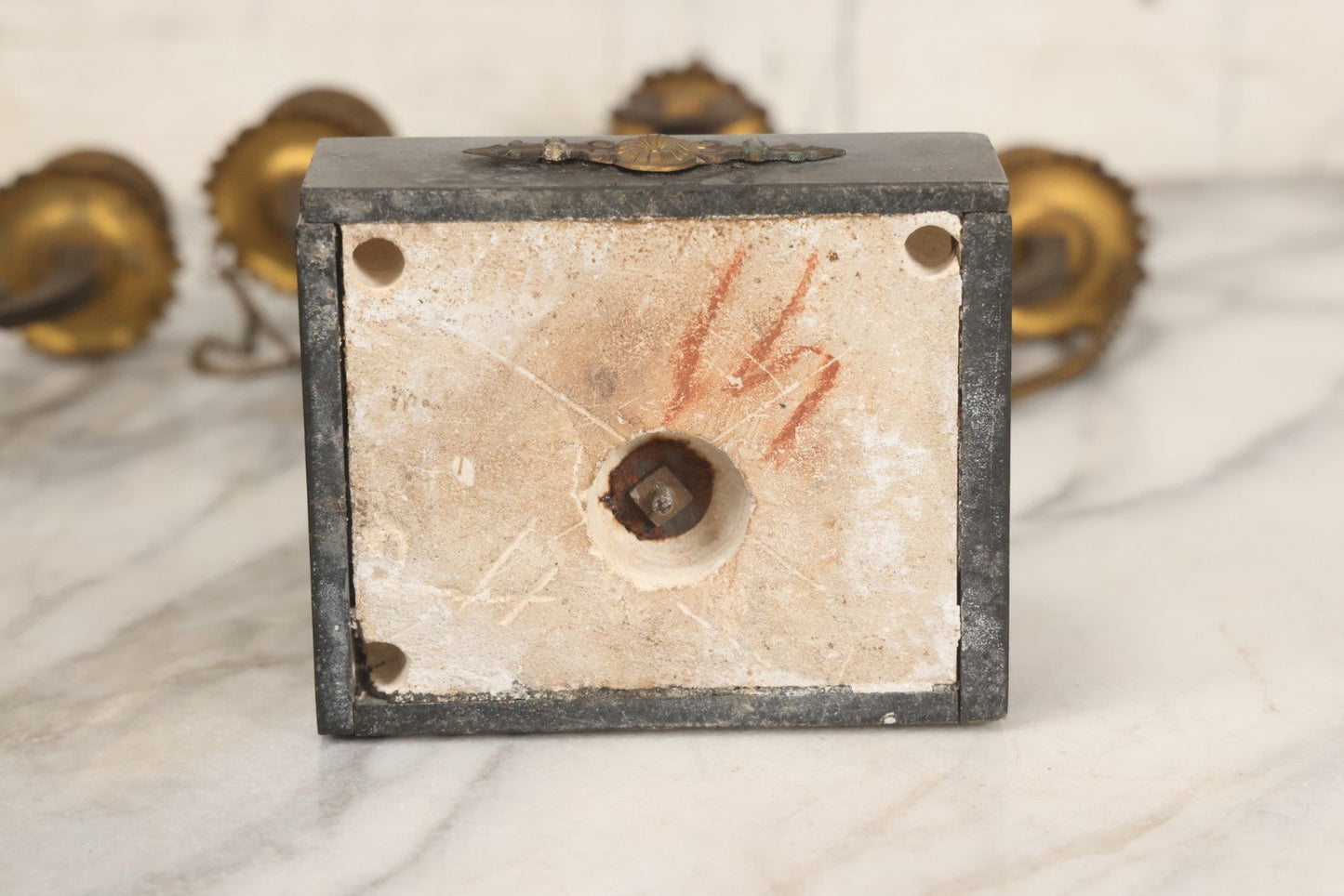 Lot 018 - Pair Of Antique Brass Three-Arm Candelabras With Floral Rosettes, Chains, And Ornate Ornamentation On Black Slate Bases, Circa 1850, 13-1/2" H Each