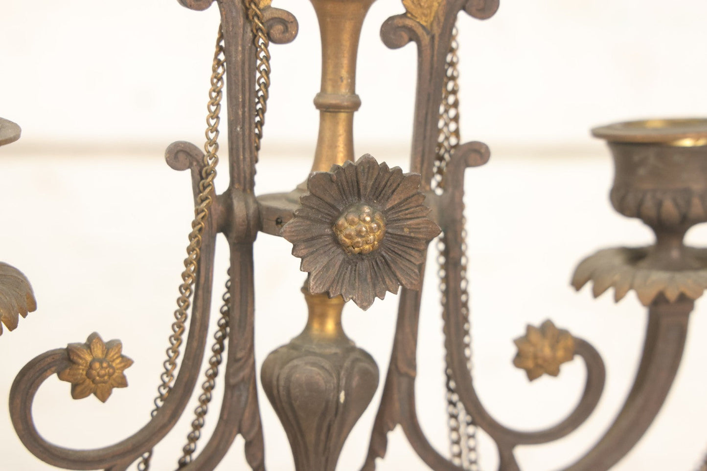 Lot 018 - Pair Of Antique Brass Three-Arm Candelabras With Floral Rosettes, Chains, And Ornate Ornamentation On Black Slate Bases, Circa 1850, 13-1/2" H Each