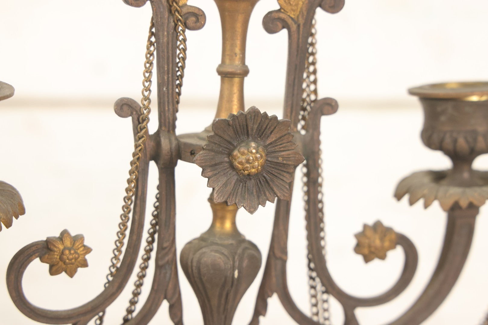 Lot 018 - Pair Of Antique Brass Three-Arm Candelabras With Floral Rosettes, Chains, And Ornate Ornamentation On Black Slate Bases, Circa 1850, 13-1/2" H Each