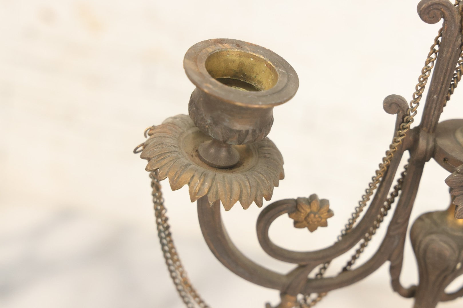Lot 018 - Pair Of Antique Brass Three-Arm Candelabras With Floral Rosettes, Chains, And Ornate Ornamentation On Black Slate Bases, Circa 1850, 13-1/2" H Each