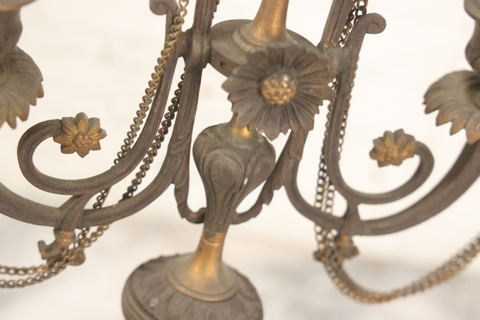 Lot 018 - Pair Of Antique Brass Three-Arm Candelabras With Floral Rosettes, Chains, And Ornate Ornamentation On Black Slate Bases, Circa 1850, 13-1/2" H Each