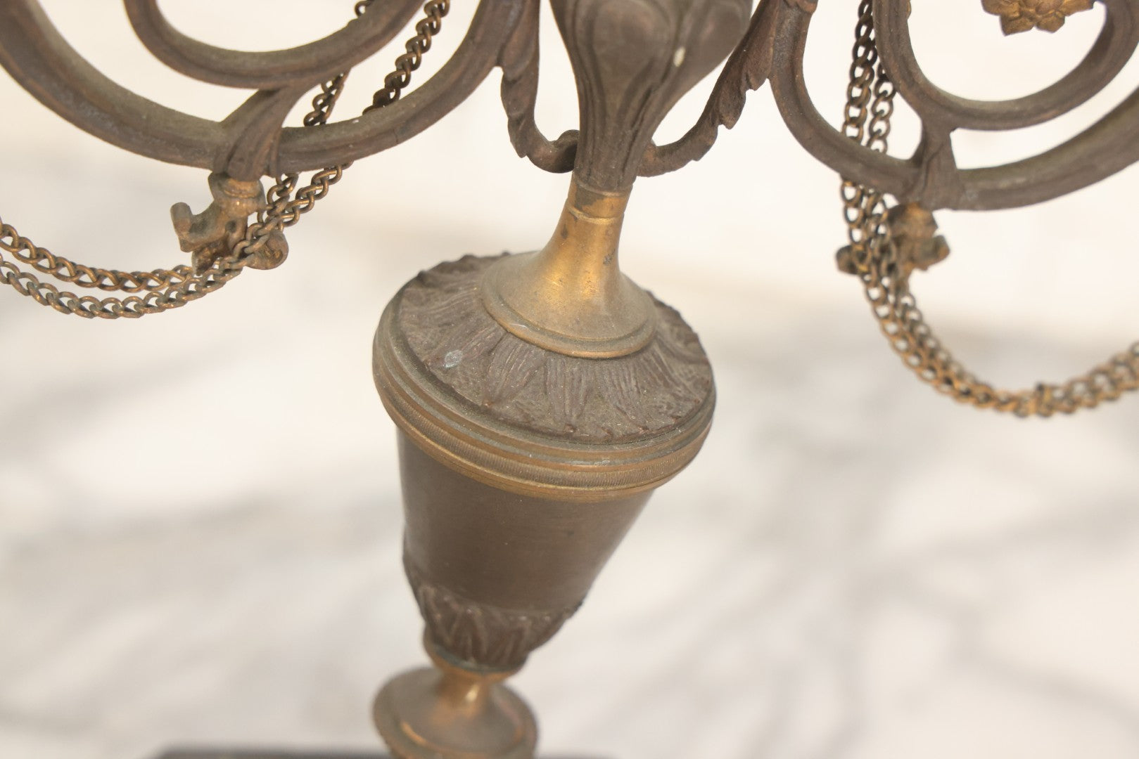 Lot 018 - Pair Of Antique Brass Three-Arm Candelabras With Floral Rosettes, Chains, And Ornate Ornamentation On Black Slate Bases, Circa 1850, 13-1/2" H Each