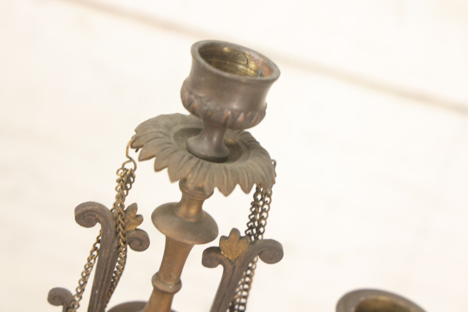 Lot 018 - Pair Of Antique Brass Three-Arm Candelabras With Floral Rosettes, Chains, And Ornate Ornamentation On Black Slate Bases, Circa 1850, 13-1/2" H Each