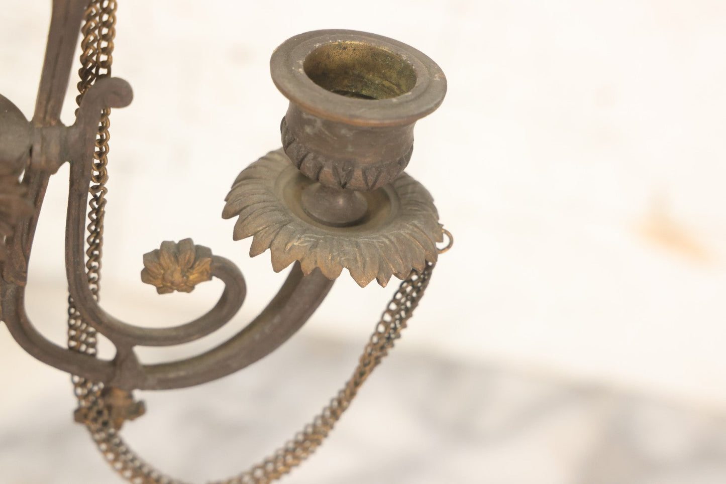 Lot 018 - Pair Of Antique Brass Three-Arm Candelabras With Floral Rosettes, Chains, And Ornate Ornamentation On Black Slate Bases, Circa 1850, 13-1/2" H Each