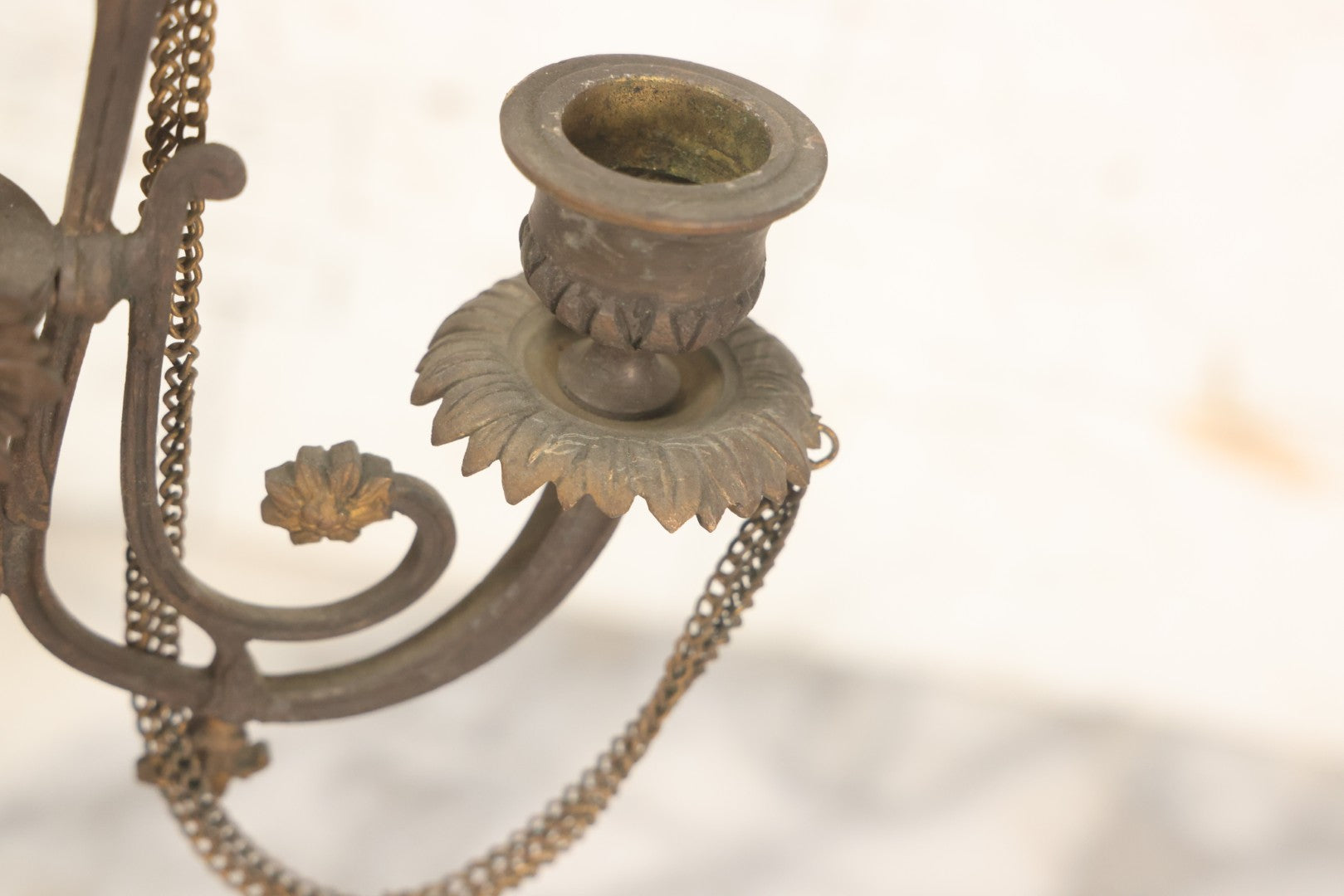 Lot 018 - Pair Of Antique Brass Three-Arm Candelabras With Floral Rosettes, Chains, And Ornate Ornamentation On Black Slate Bases, Circa 1850, 13-1/2" H Each