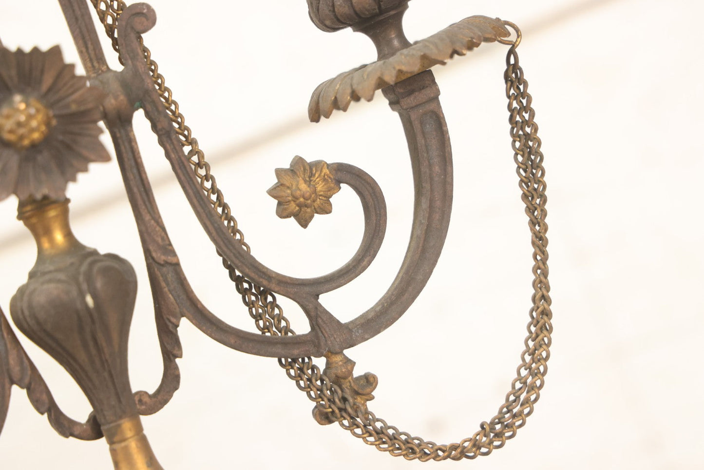 Lot 018 - Pair Of Antique Brass Three-Arm Candelabras With Floral Rosettes, Chains, And Ornate Ornamentation On Black Slate Bases, Circa 1850, 13-1/2" H Each