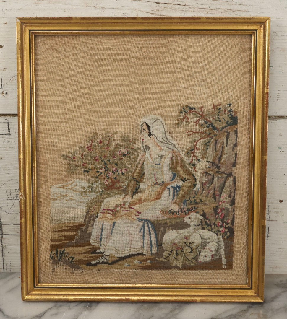Lot 021 - Antique Framed Needlepoint Tapestry Depicting A Seated Woman With Lambs, Circa Mid 19th Century, In Gilt Wood Frame, Far Gallery, New York, 11-3/4" x 13-1/2"