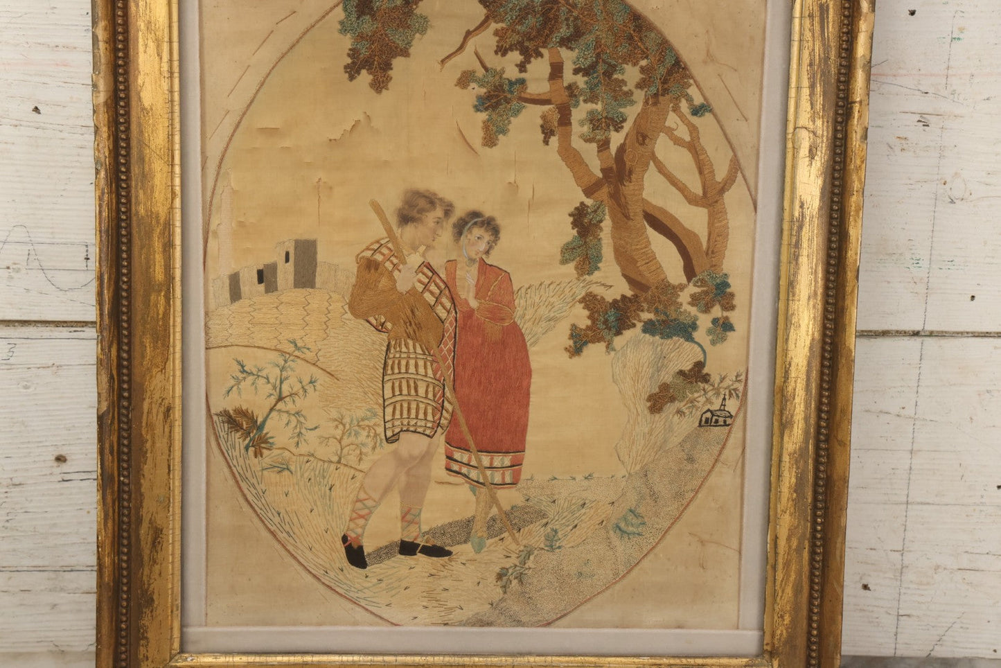 Lot 022 - Antique Framed Needlework Embroidery Depicting A Pastoral Scene With A Scottish Couple Beneath A Tree, Circa Early 19th Century, In Gilt Wood Frame, Arteffects Gallery, Northampton, Massachusetts, 17" x 19-3/4"