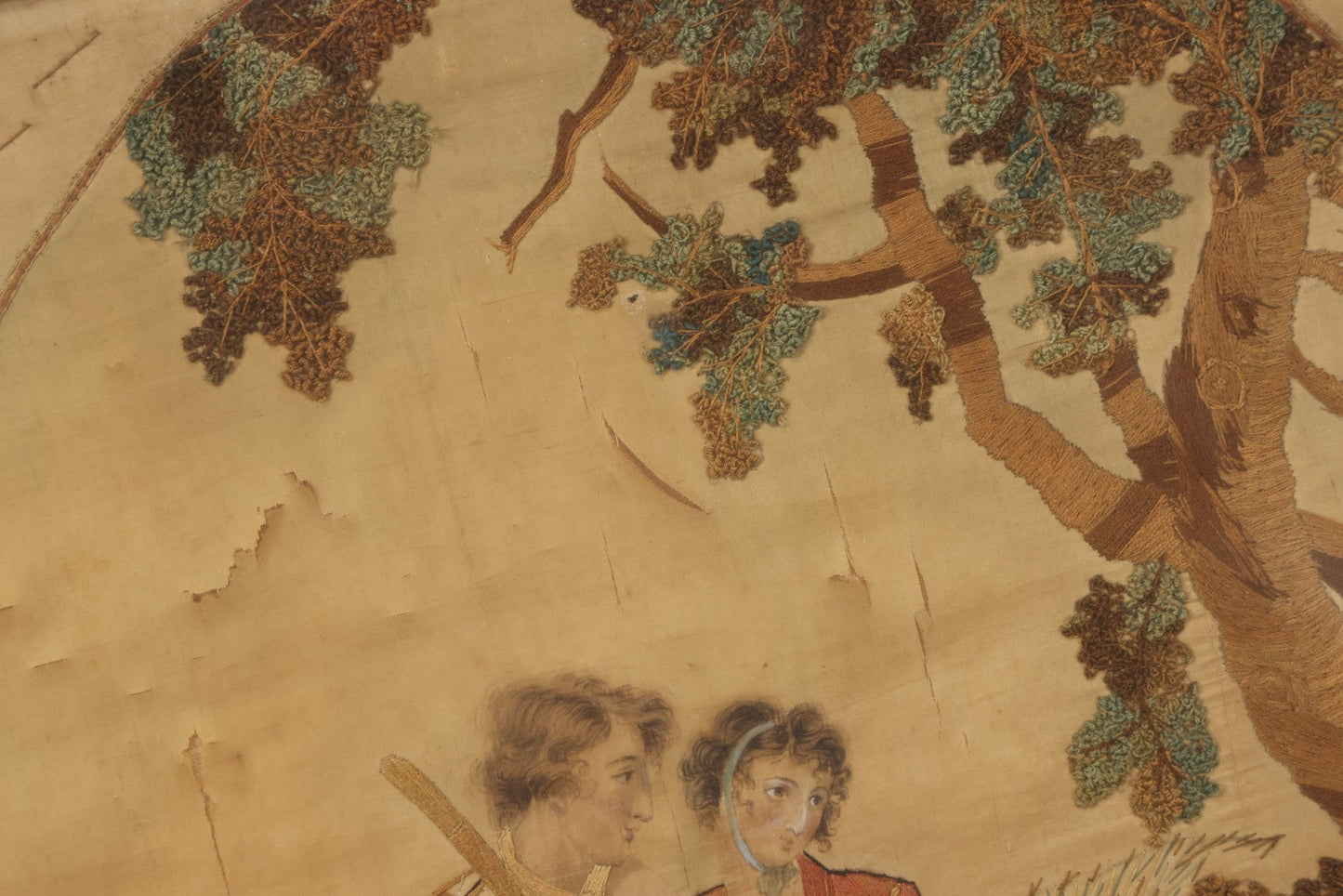 Lot 022 - Antique Framed Needlework Embroidery Depicting A Pastoral Scene With A Scottish Couple Beneath A Tree, Circa Early 19th Century, In Gilt Wood Frame, Arteffects Gallery, Northampton, Massachusetts, 17" x 19-3/4"