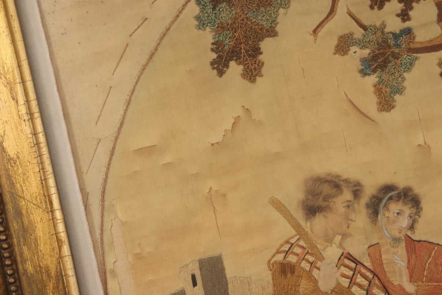 Lot 022 - Antique Framed Needlework Embroidery Depicting A Pastoral Scene With A Scottish Couple Beneath A Tree, Circa Early 19th Century, In Gilt Wood Frame, Arteffects Gallery, Northampton, Massachusetts, 17" x 19-3/4"