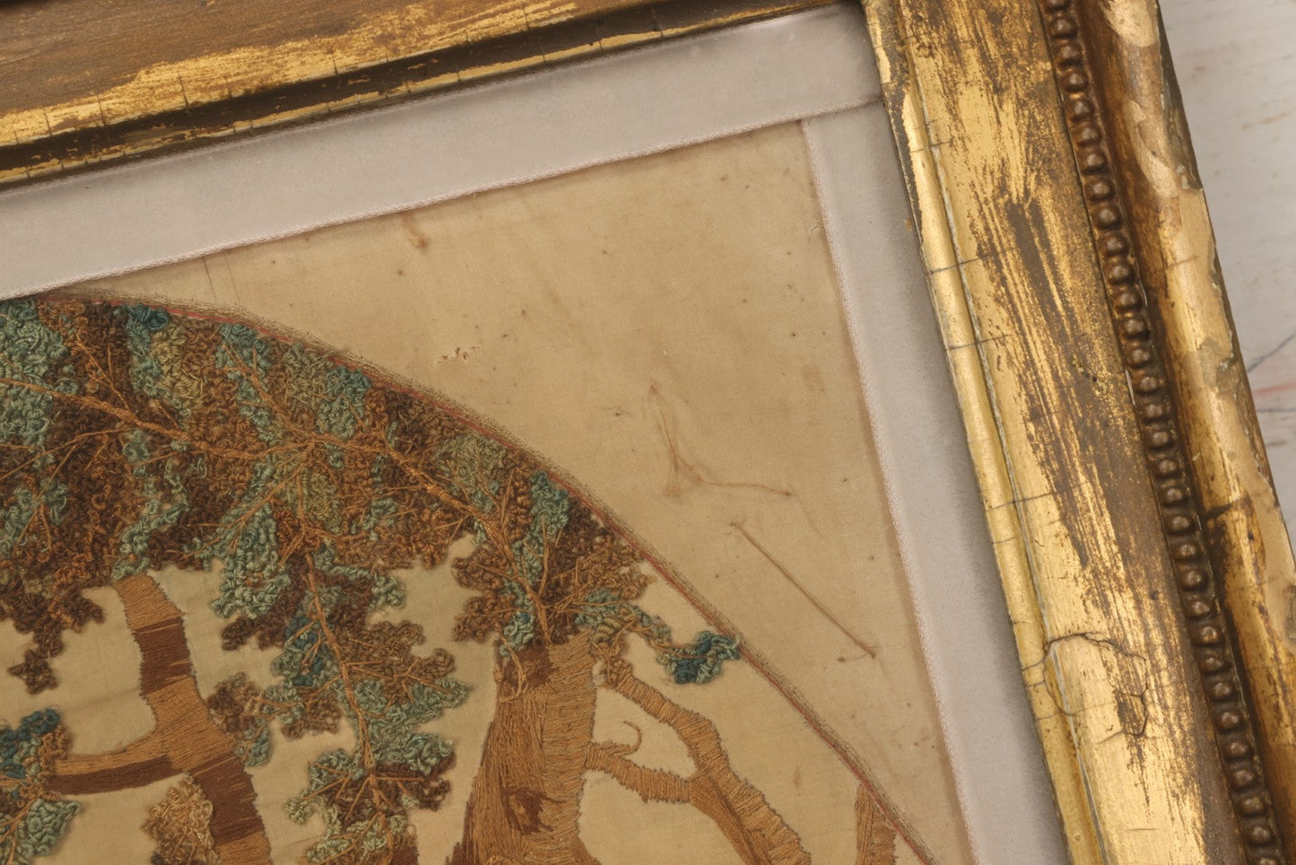 Lot 022 - Antique Framed Needlework Embroidery Depicting A Pastoral Scene With A Scottish Couple Beneath A Tree, Circa Early 19th Century, In Gilt Wood Frame, Arteffects Gallery, Northampton, Massachusetts, 17" x 19-3/4"