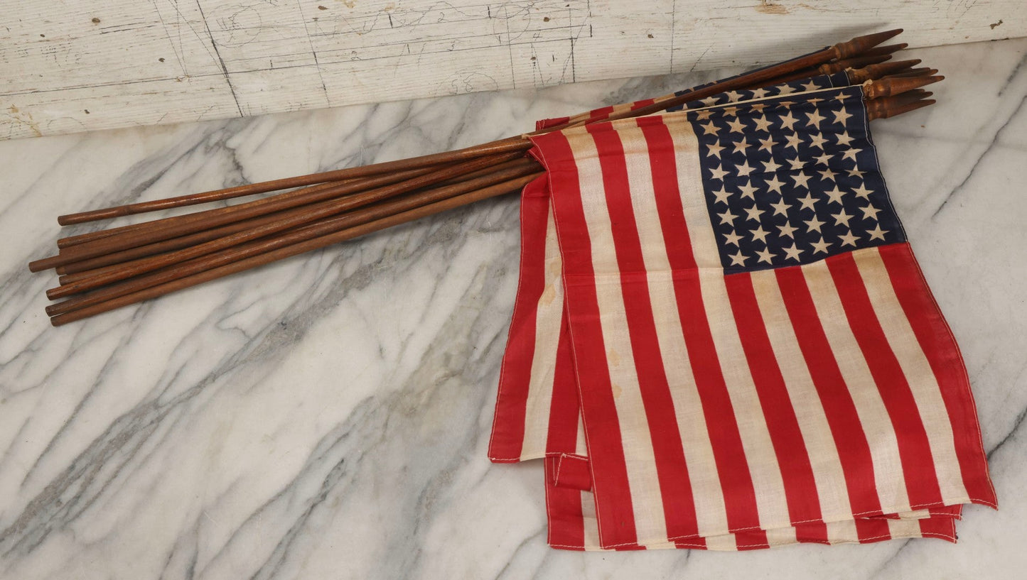 Lot 036 - Bundle Of Twelve Vintage 48-Star Hand-Held Parade Flags On Wooden Poles With Finials, Poles 32-1/2" L Each