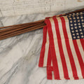 Lot 036 - Bundle Of Twelve Vintage 48-Star Hand-Held Parade Flags On Wooden Poles With Finials, Poles 32-1/2" L Each
