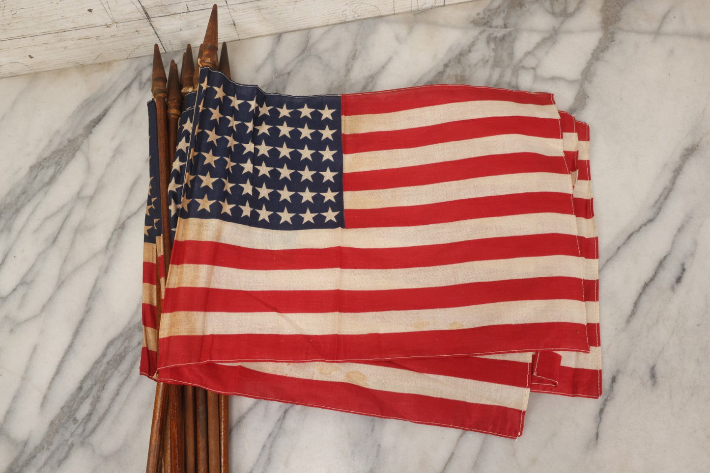 Lot 036 - Bundle Of Twelve Vintage 48-Star Hand-Held Parade Flags On Wooden Poles With Finials, Poles 32-1/2" L Each