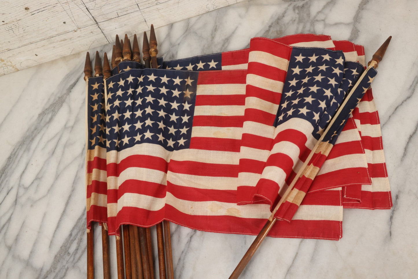 Lot 036 - Bundle Of Twelve Vintage 48-Star Hand-Held Parade Flags On Wooden Poles With Finials, Poles 32-1/2" L Each