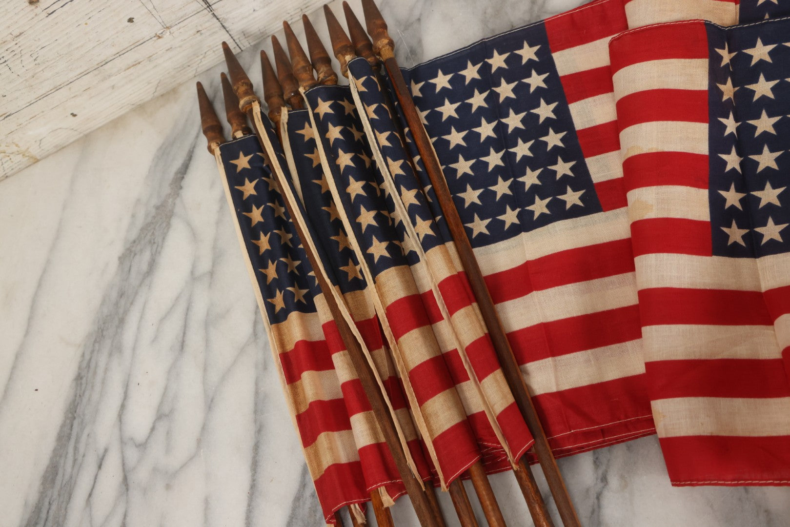 Lot 036 - Bundle Of Twelve Vintage 48-Star Hand-Held Parade Flags On Wooden Poles With Finials, Poles 32-1/2" L Each
